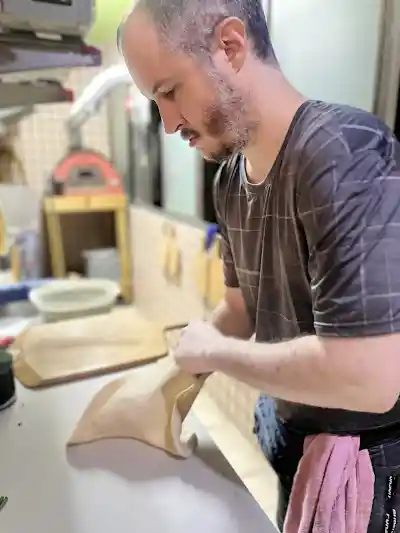 Close-up of pizza preparation
